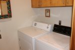 The laundry room is located downstairs